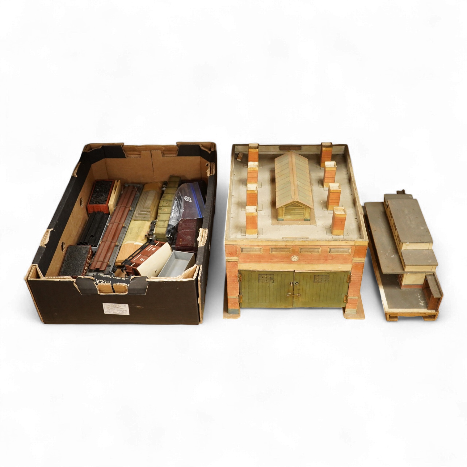 Eleven 0 gauge railway wooden freight wagons, wooden bodies and most possibly kit built using Bonds etc. parts, including a Leeds bogie mineral wagon, together with two kit or scratchbuilt wooden London Underground stati